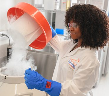 student doing experiment student doing experiment