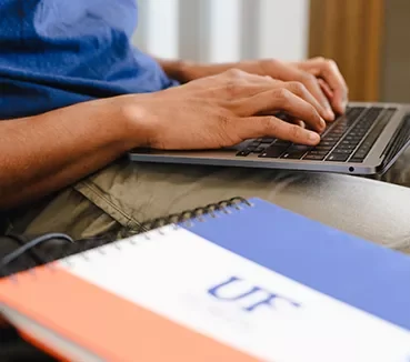 cards-programs-laptop typing on laptop